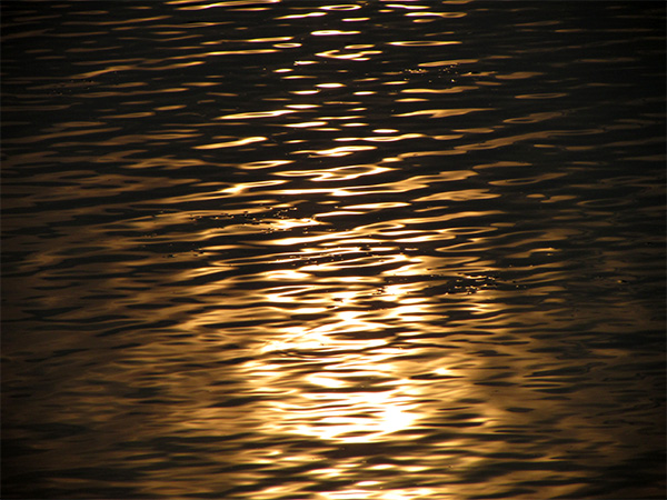 Photo of light on water.