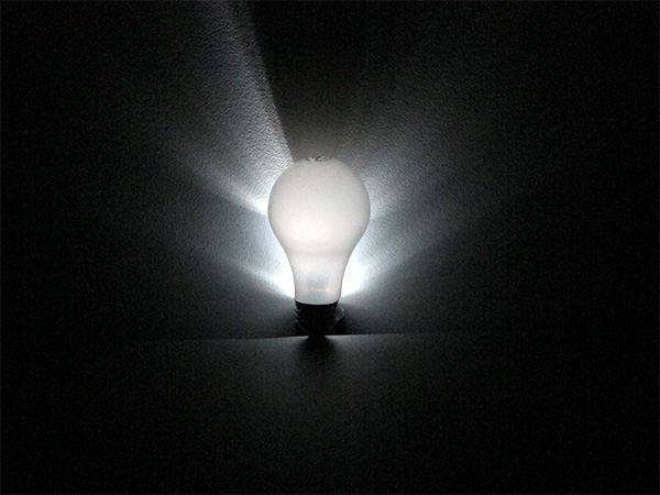 Photo of a back-lit light bulb.